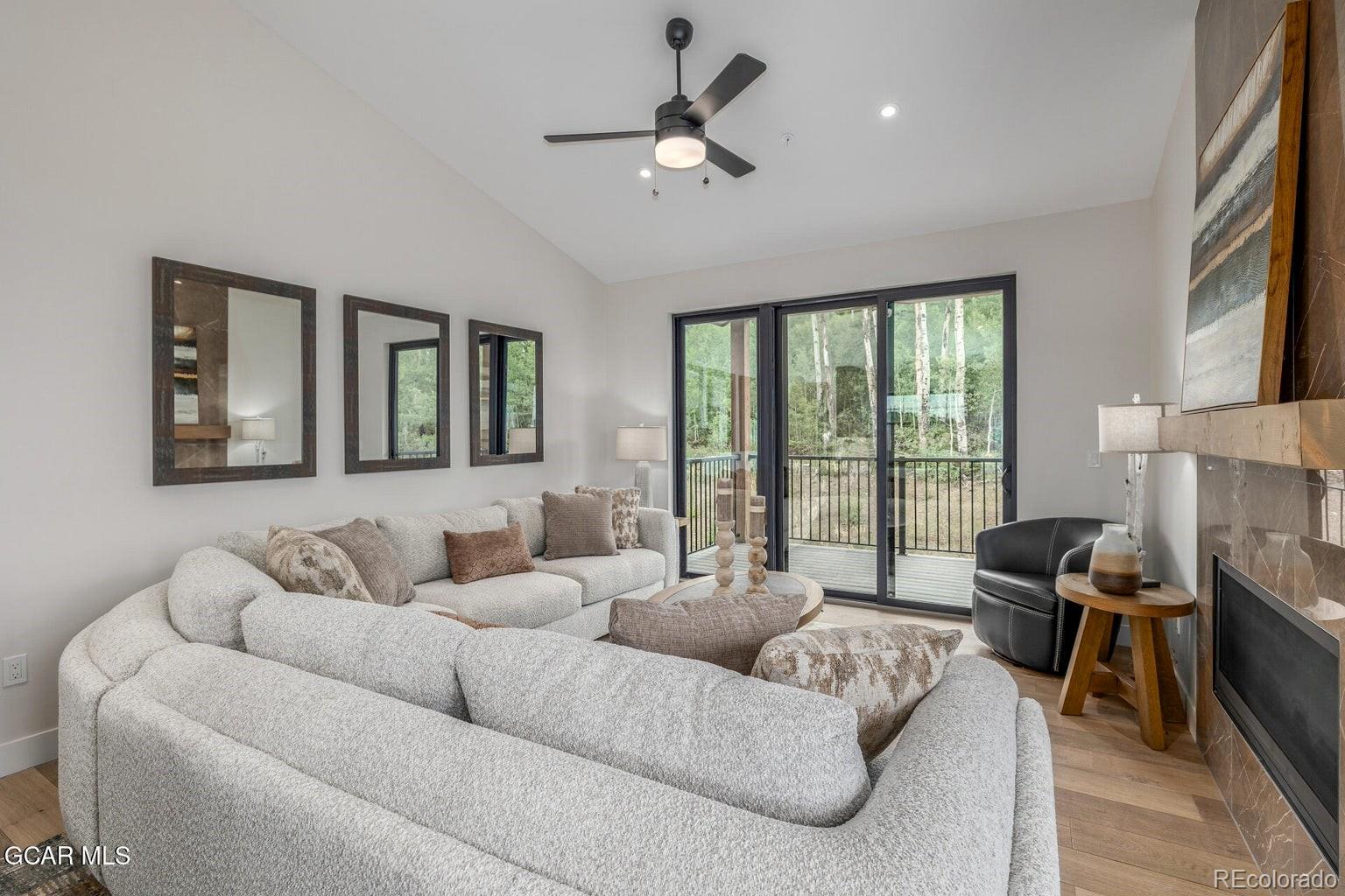 104 Saddle Mountain Camp Road Granby, CO 80446 - Photo 10 of 50 a living room with furniture and a large window
