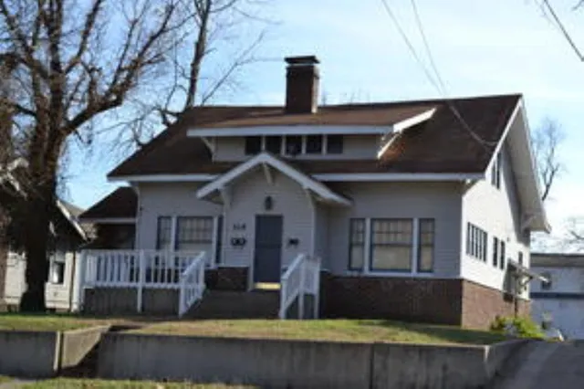 a front view of a house with garage