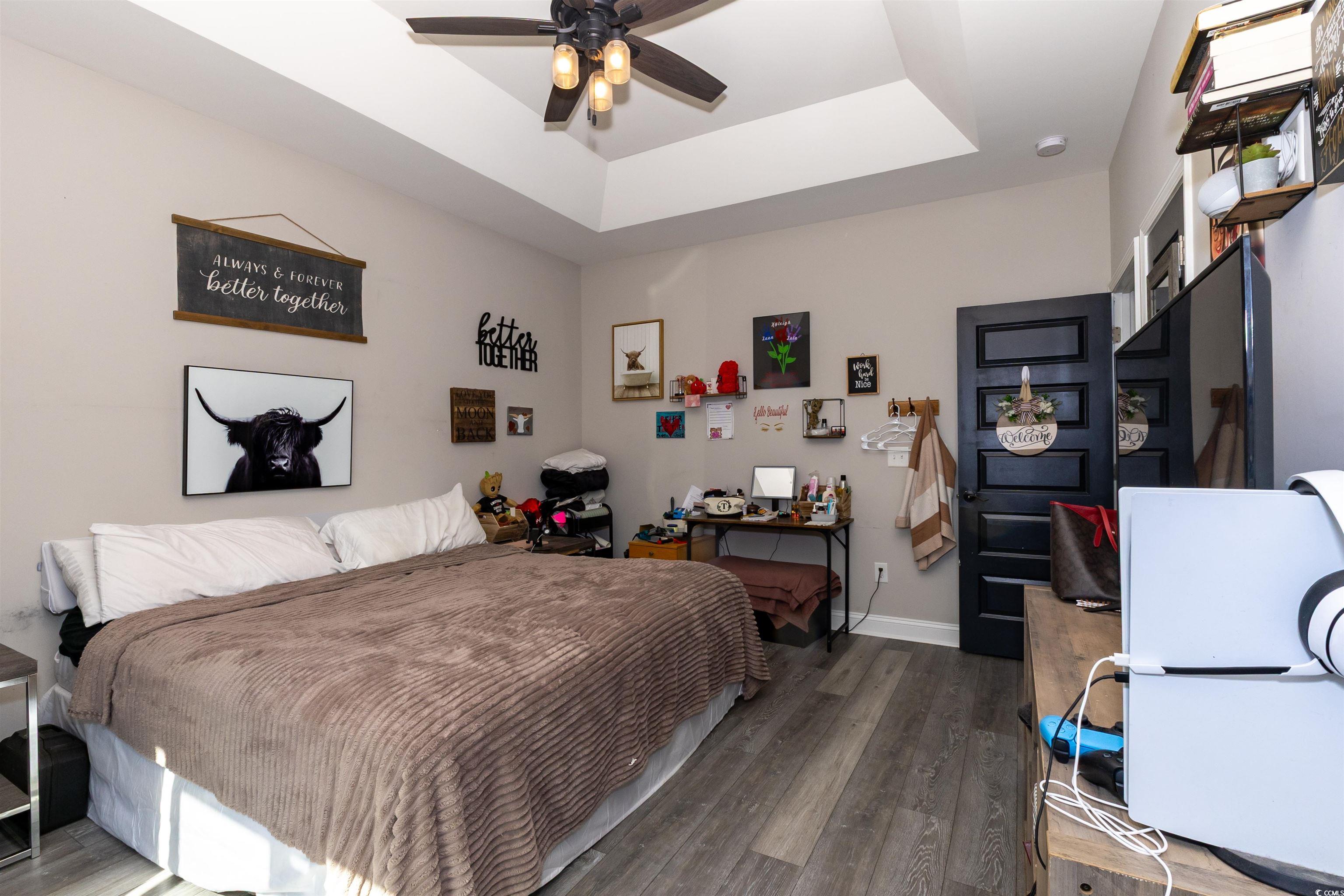 1501 Grainger Road Conway, SC 29527 - Photo 10 of 22 Bedroom featuring a raised ceiling, wood finished