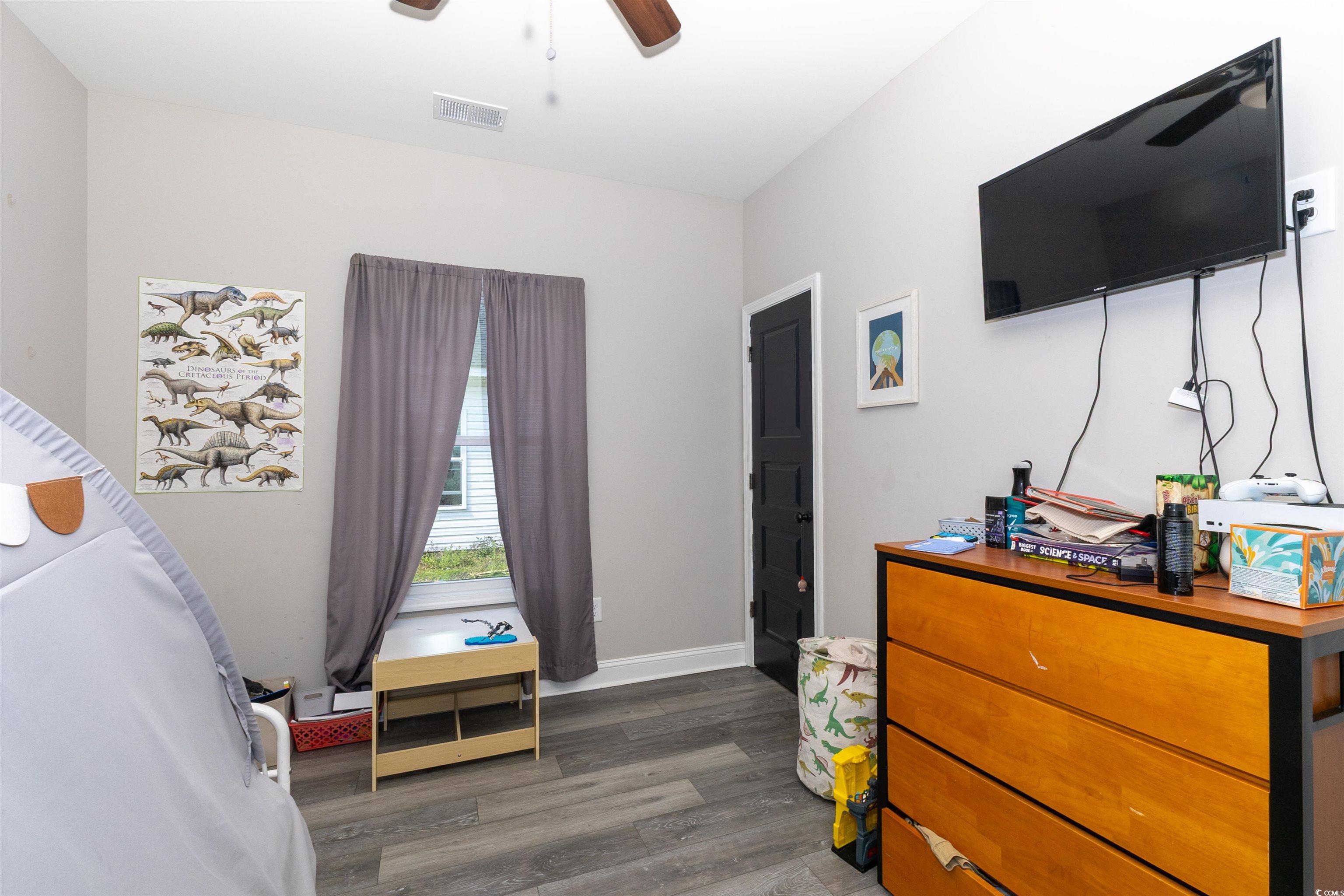 1501 Grainger Road Conway, SC 29527 - Photo 15 of 22 Bedroom featuring ceiling fan, baseboards, dark wo