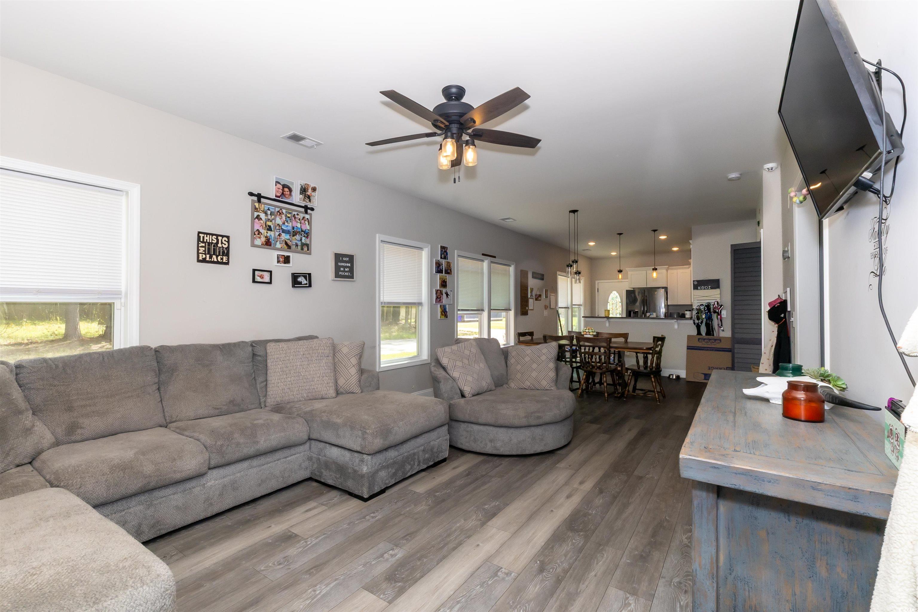 1501 Grainger Road Conway, SC 29527 - Photo 5 of 22 Living room with visible vents, ceiling fan, wood