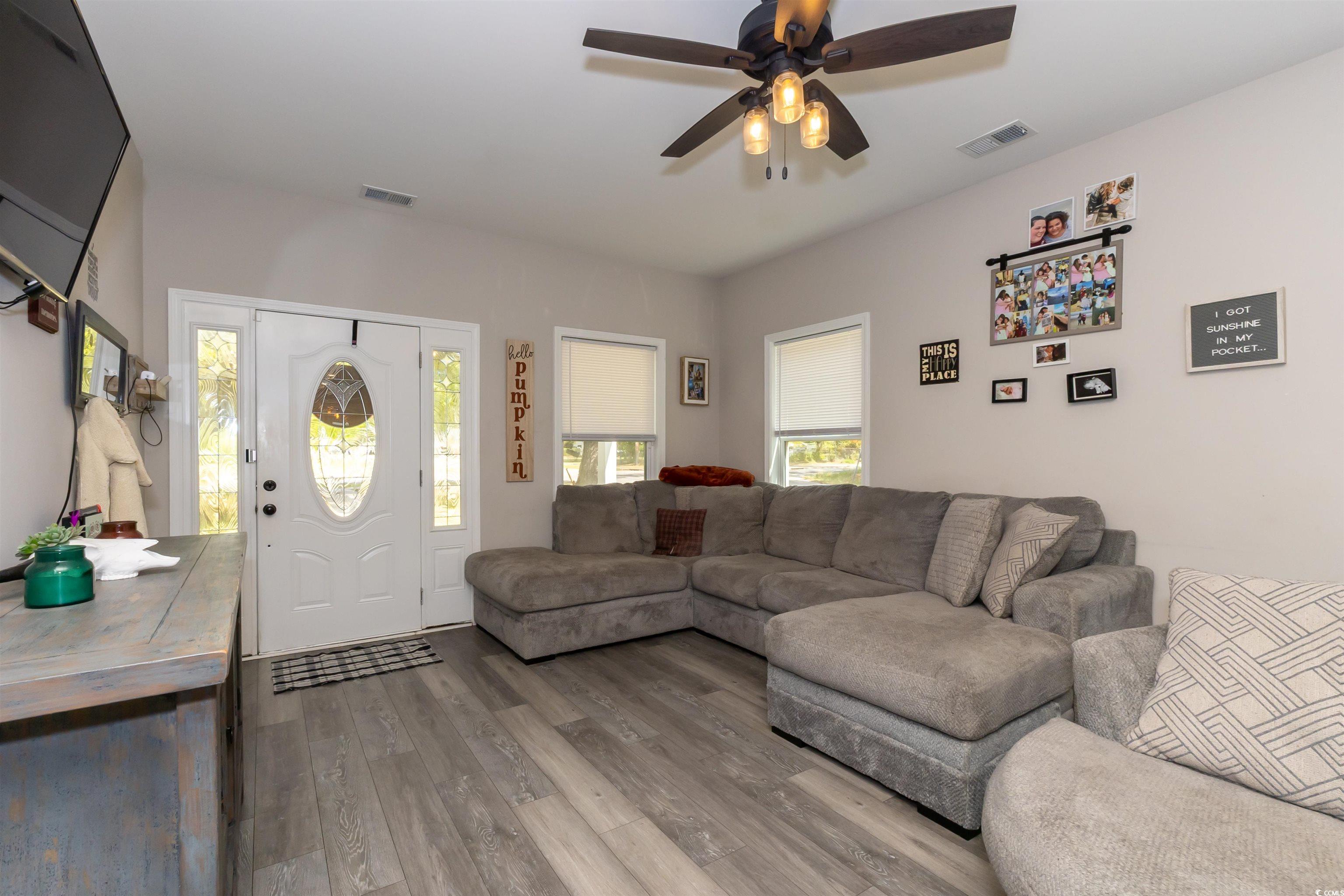 1501 Grainger Road Conway, SC 29527 - Photo 6 of 22 Living area with wood finished floors, a ceiling f