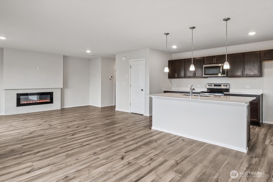 131 Willowbrook Drive Chehalis, WA 98532 - Photo 11 of 29 a view of kitchen with stainless steel appliances granite countertop cabinets and wooden floor