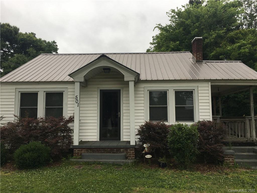 501 Union Cemetery Road Southwest Concord, NC 28027 - Photo 1 of 10 a front view of a house with a garden