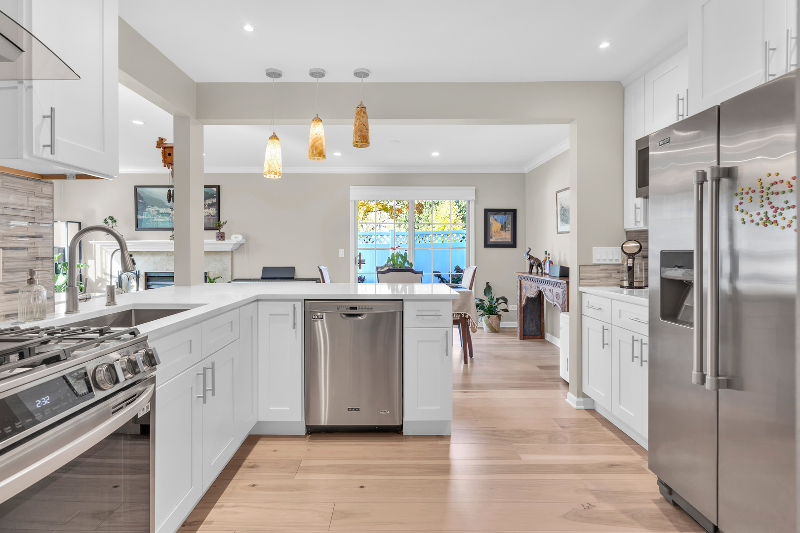 473 Le Parc Circle Buffalo Grove, IL 60089 - Photo 15 of 30 a kitchen with white cabinets and stainless steel appliances