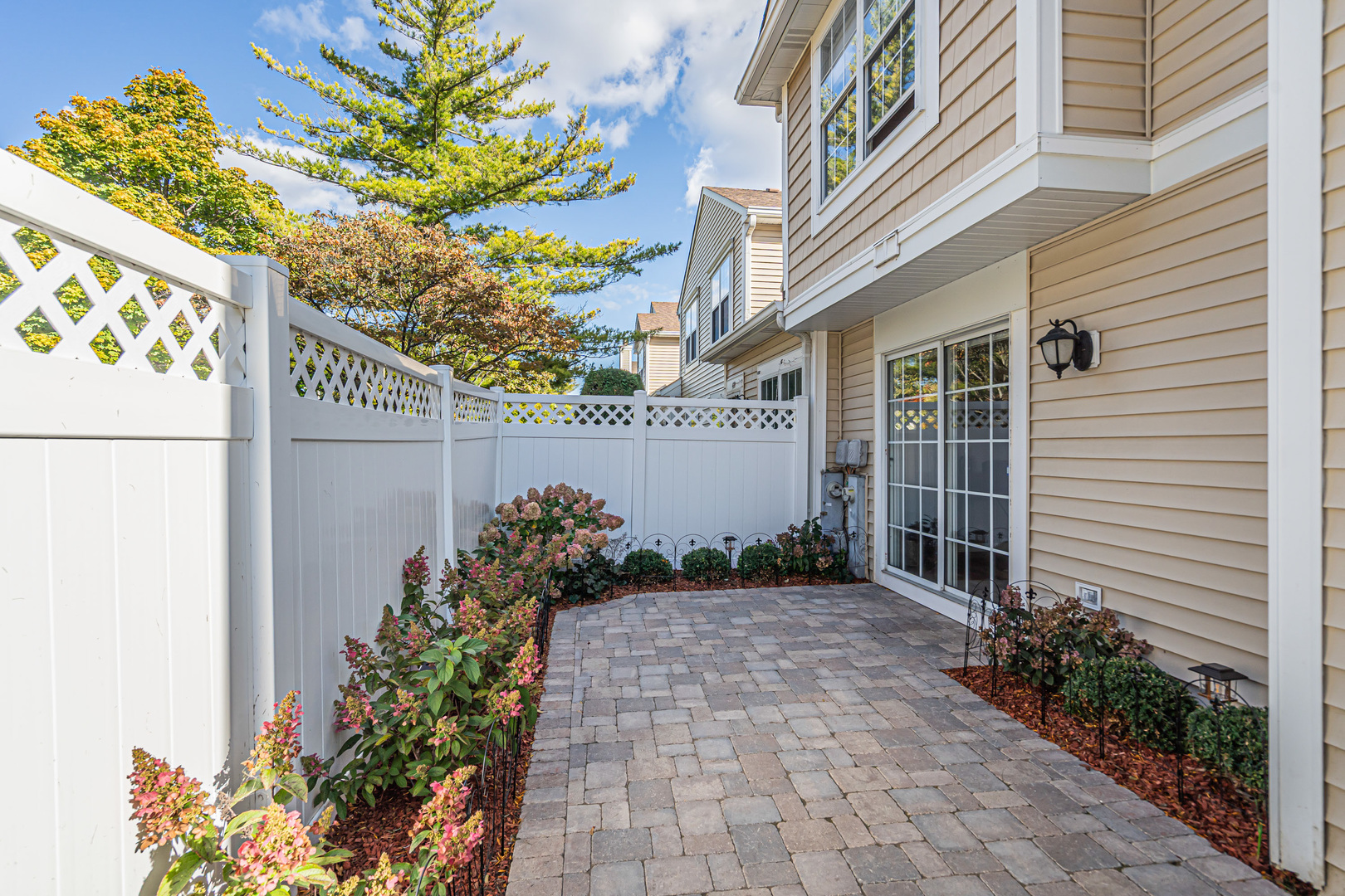 473 Le Parc Circle Buffalo Grove, IL 60089 - Photo 28 of 30 a view of a house with a flower garden