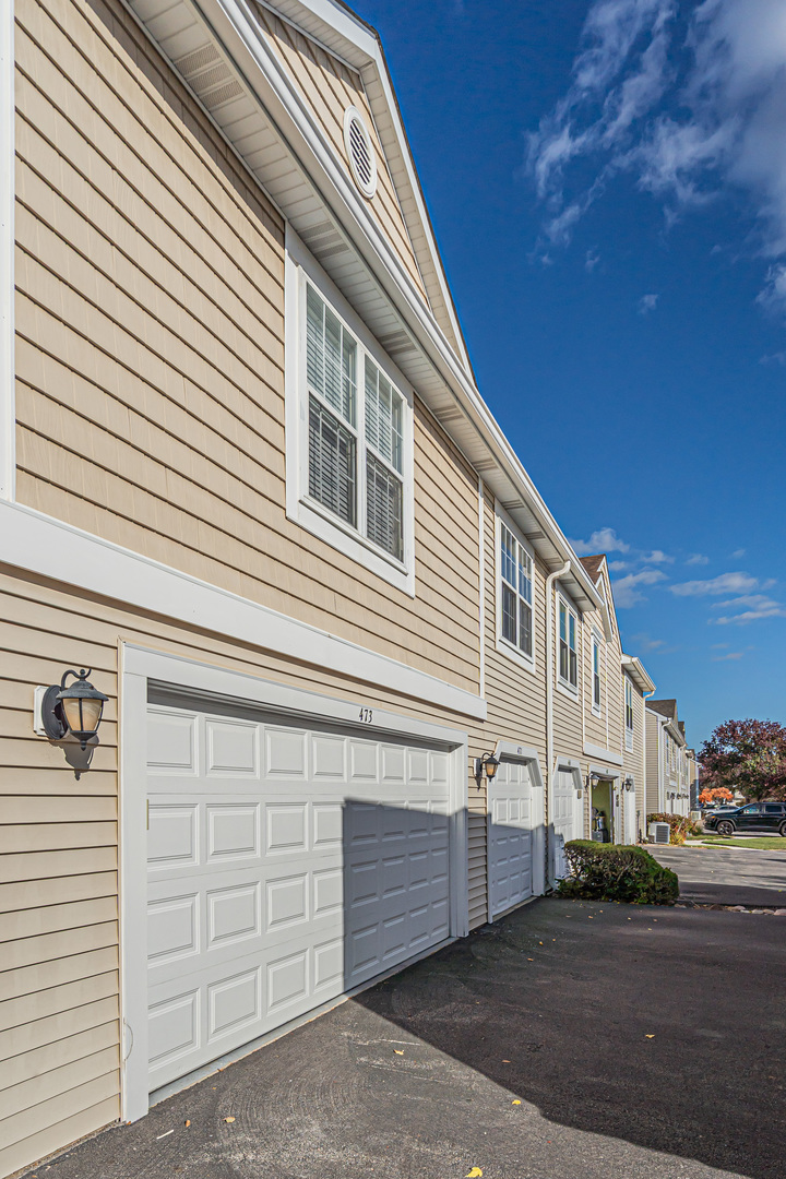 473 Le Parc Circle Buffalo Grove, IL 60089 - Photo 30 of 30 a view of a house with a garage