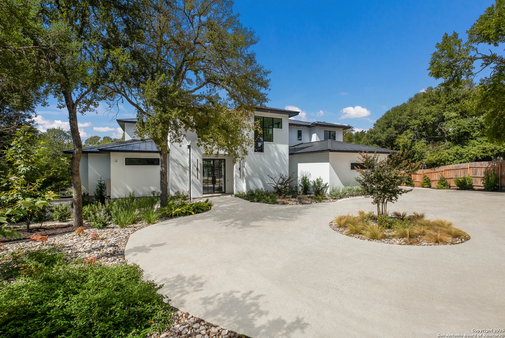 1341 Palmetto Spring Branch Spring Branch, TX 78070 - Photo 2 of 64 a front view of a house with a yard and garage