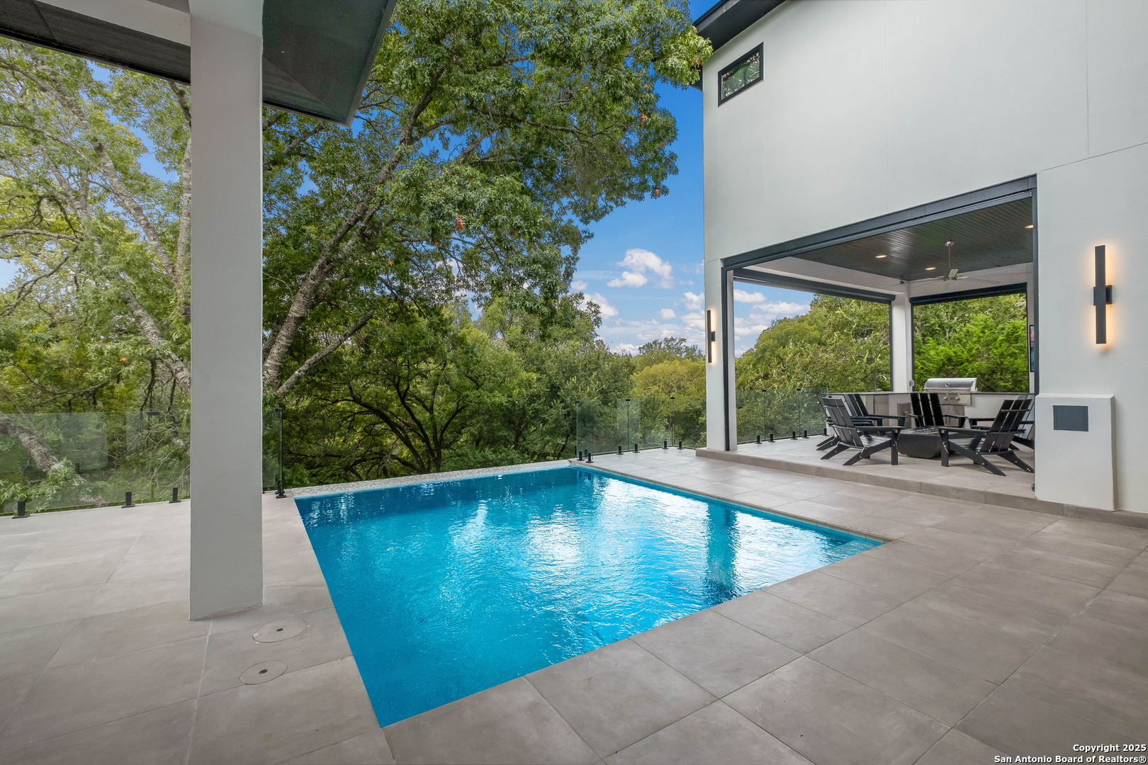 1341 Palmetto Spring Branch Spring Branch, TX 78070 - Photo 59 of 64 a view of a swimming pool with a lounge chair