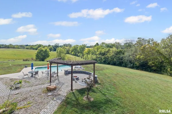 a view of a golf course with outside space