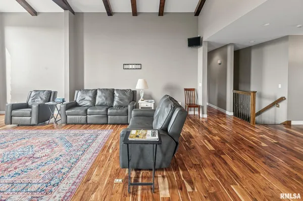 a large kitchen with kitchen island a sink table and chairs