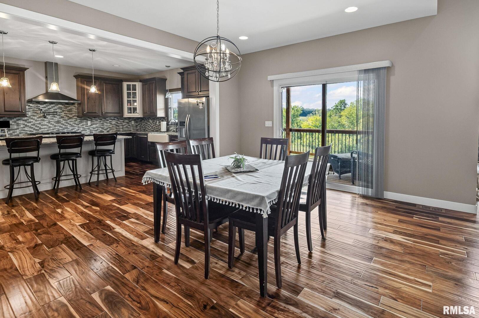 71 Ehlers Road Campbell Hill, IL 62916 - Photo 39 of 70 a view of a dining room with furniture window and wooden floor