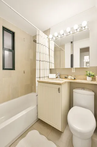 a kitchen with stainless steel appliances a stove a sink dishwasher and a refrigerator with wooden floor