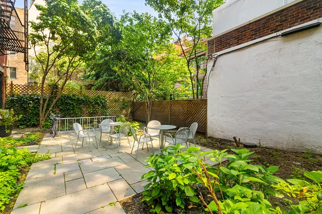 a view of a pathway both side of the house