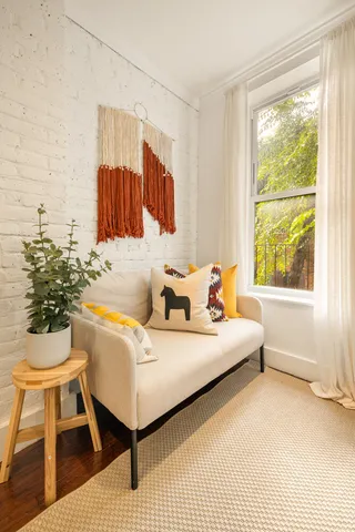 a spacious bedroom with a bed and a table in it