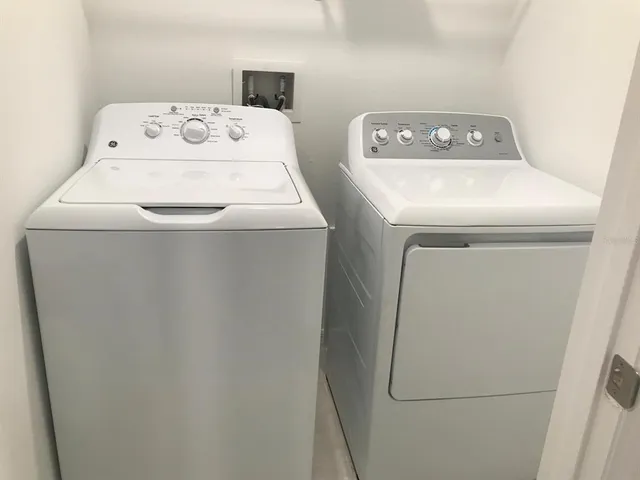 a utility room with dryer and washer