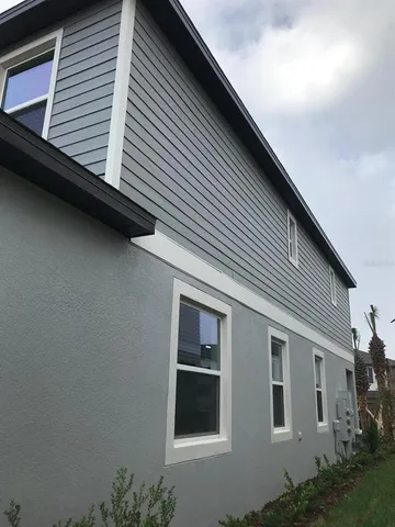 a view of a house with a large window