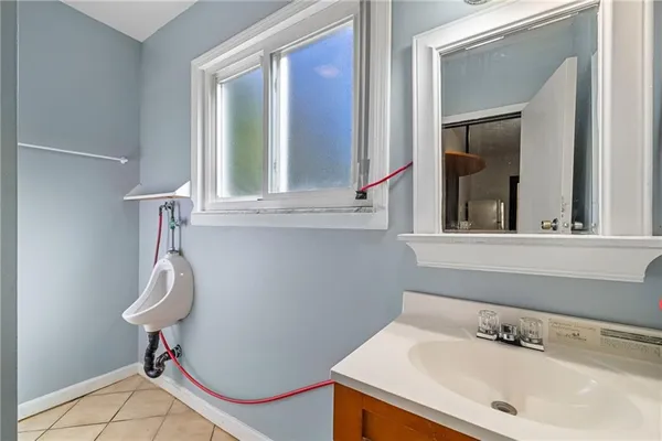 a bathroom with a sink and a window