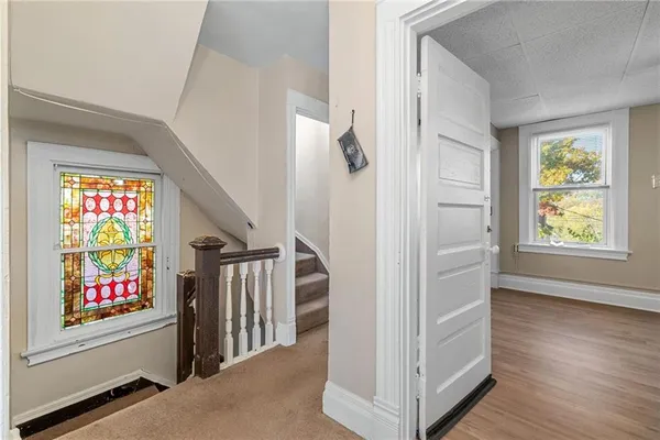 wooden floor with white walls