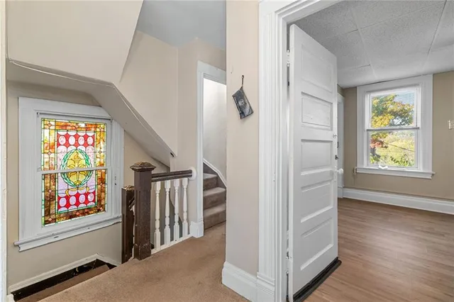 wooden floor with white walls