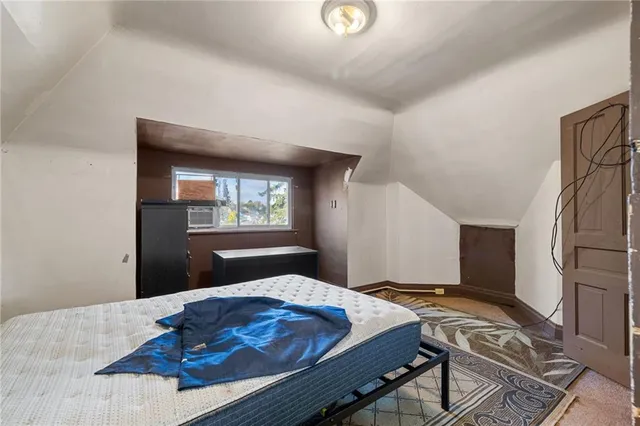 a bedroom with a bed and a table