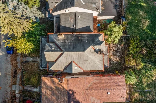 an aerial view of a house with a yard and balcony