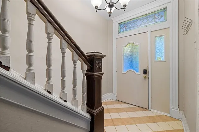 a view of staircase with white walls and railing