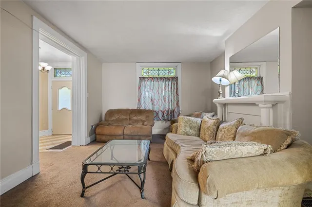 a bedroom with furniture and a window