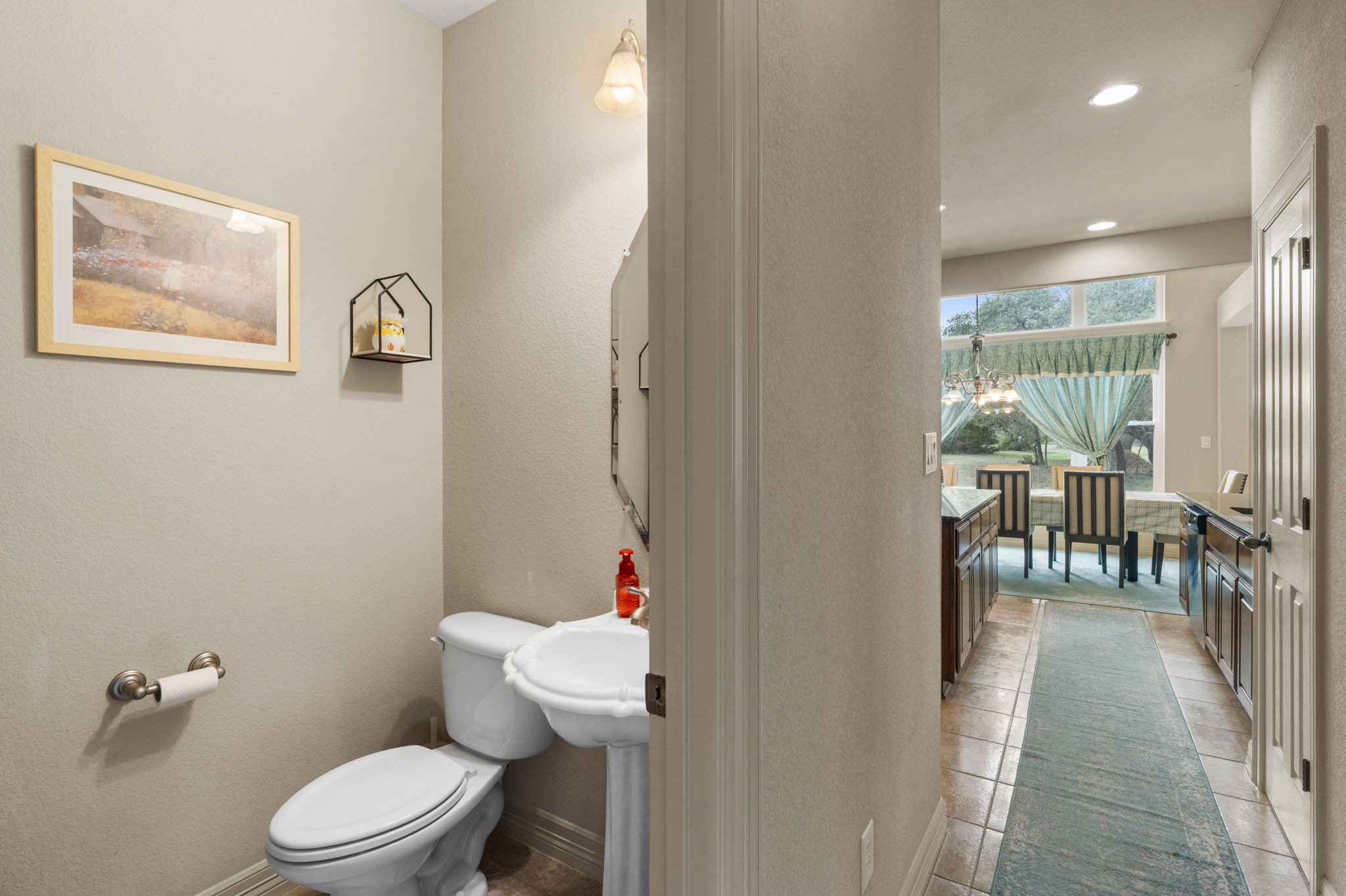 239 Whitney Run Buda, TX 78610 - Photo 16 of 40 Half bath on first floor