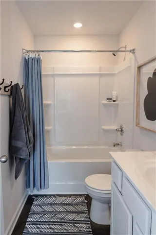 a bathroom with a sink a toilet and a bathtub