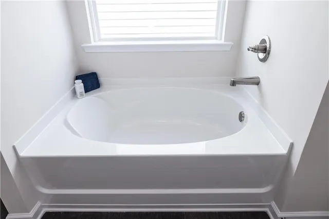 a close view of a bathtub in a bathroom