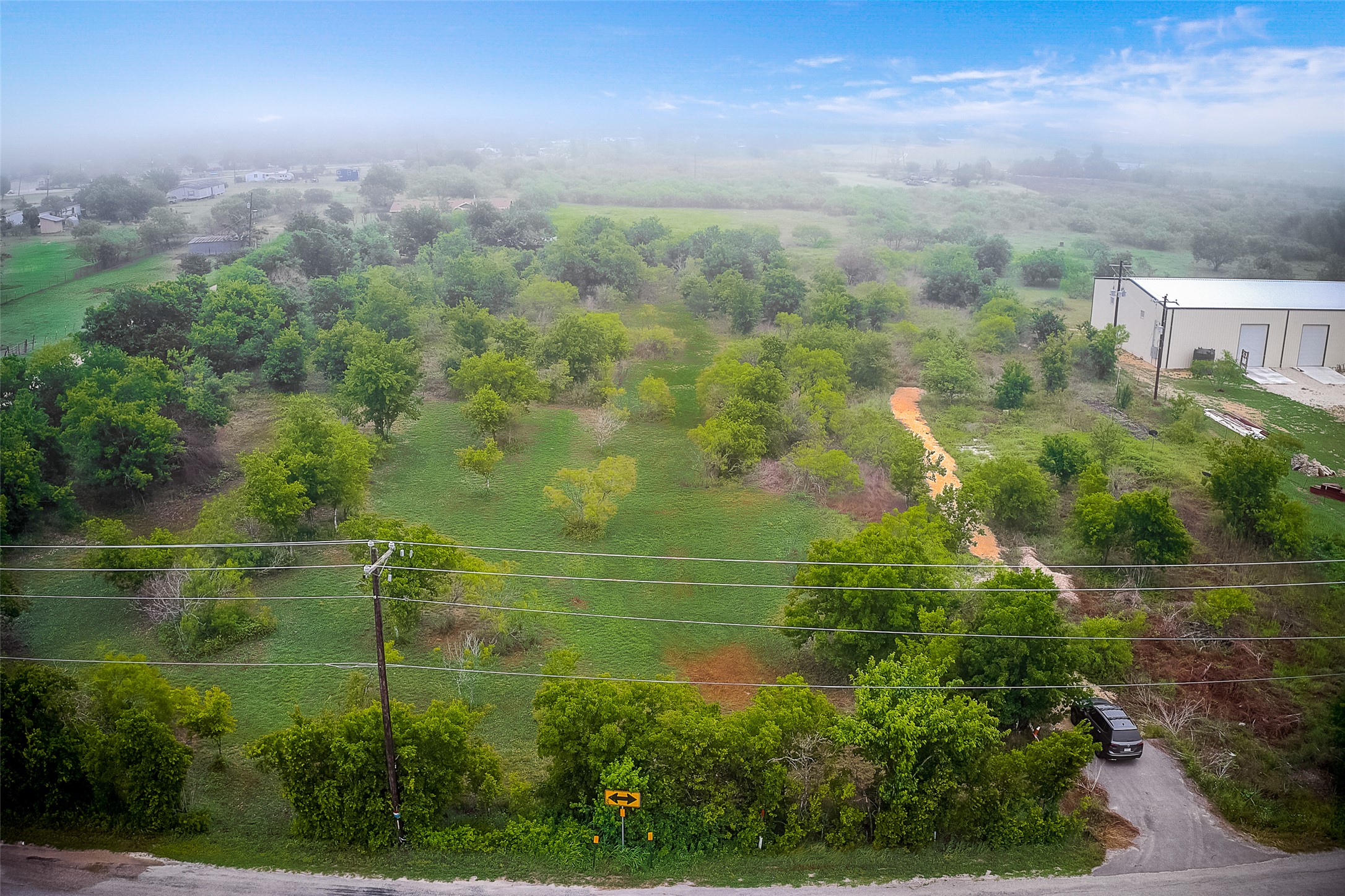 788 Williamson Road Kyle, TX 78640 - Photo 14 of 15 an aerial view of residential houses with outdoor space and trees