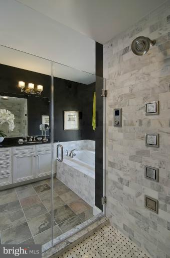 1407 Ridgeview Way Washington, DC 20007 - Photo 19 of 30 a bathroom with a granite countertop sink a large mirror and shower
