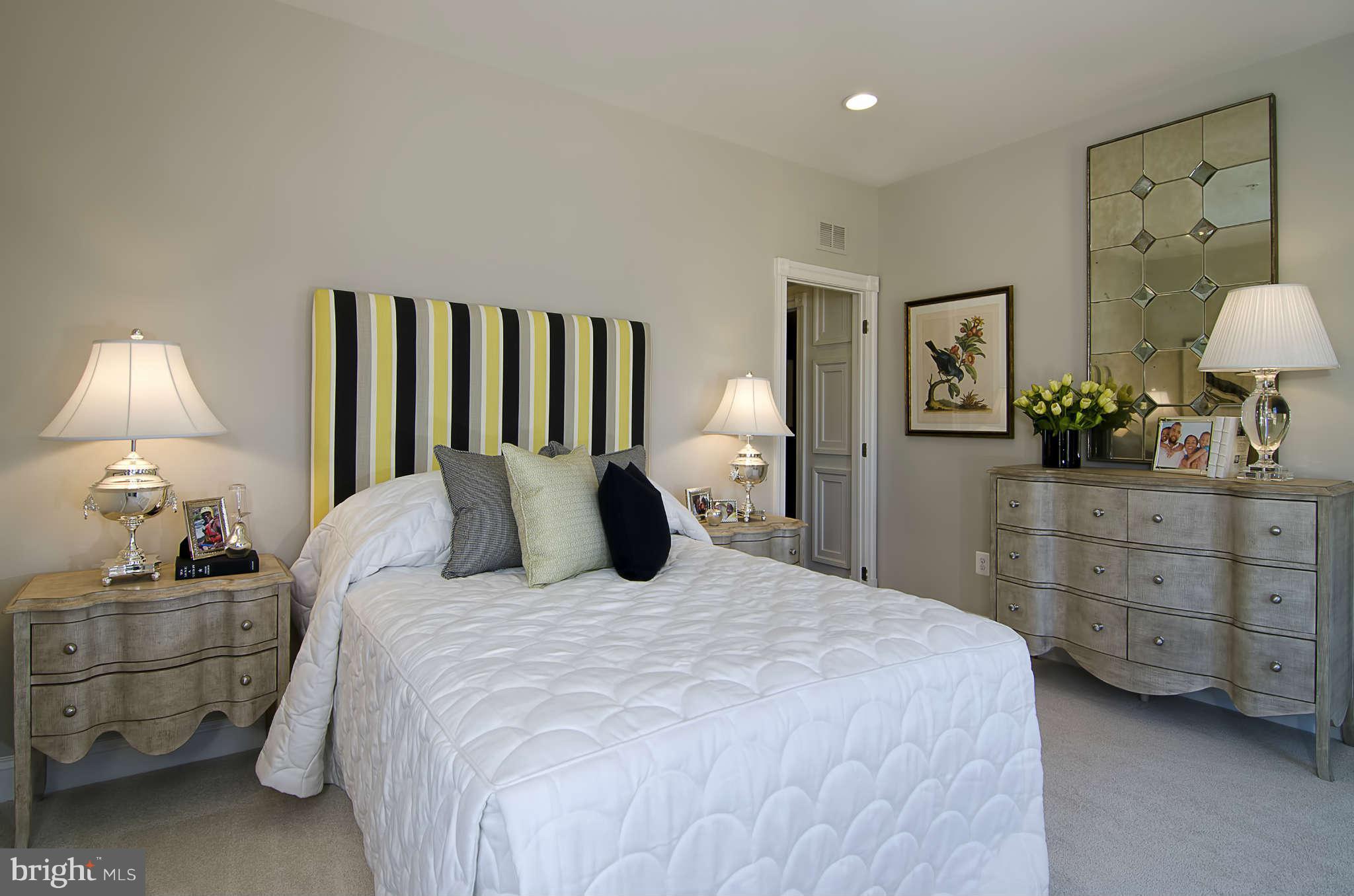 1407 Ridgeview Way Washington, DC 20007 - Photo 21 of 30 a bedroom with a bed and a lamp on dresser