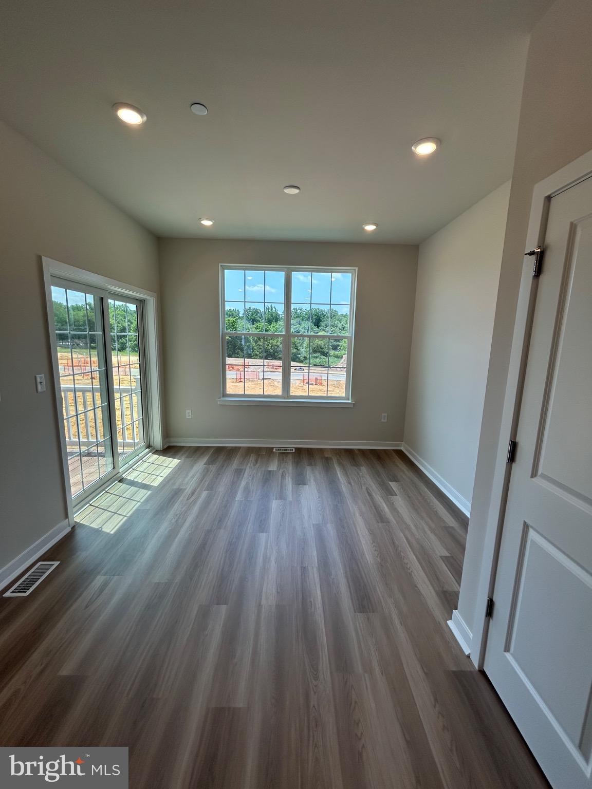 28 Barnes Way Sicklerville, NJ 08081 - Photo 15 of 40 an empty room with wooden floor and windows