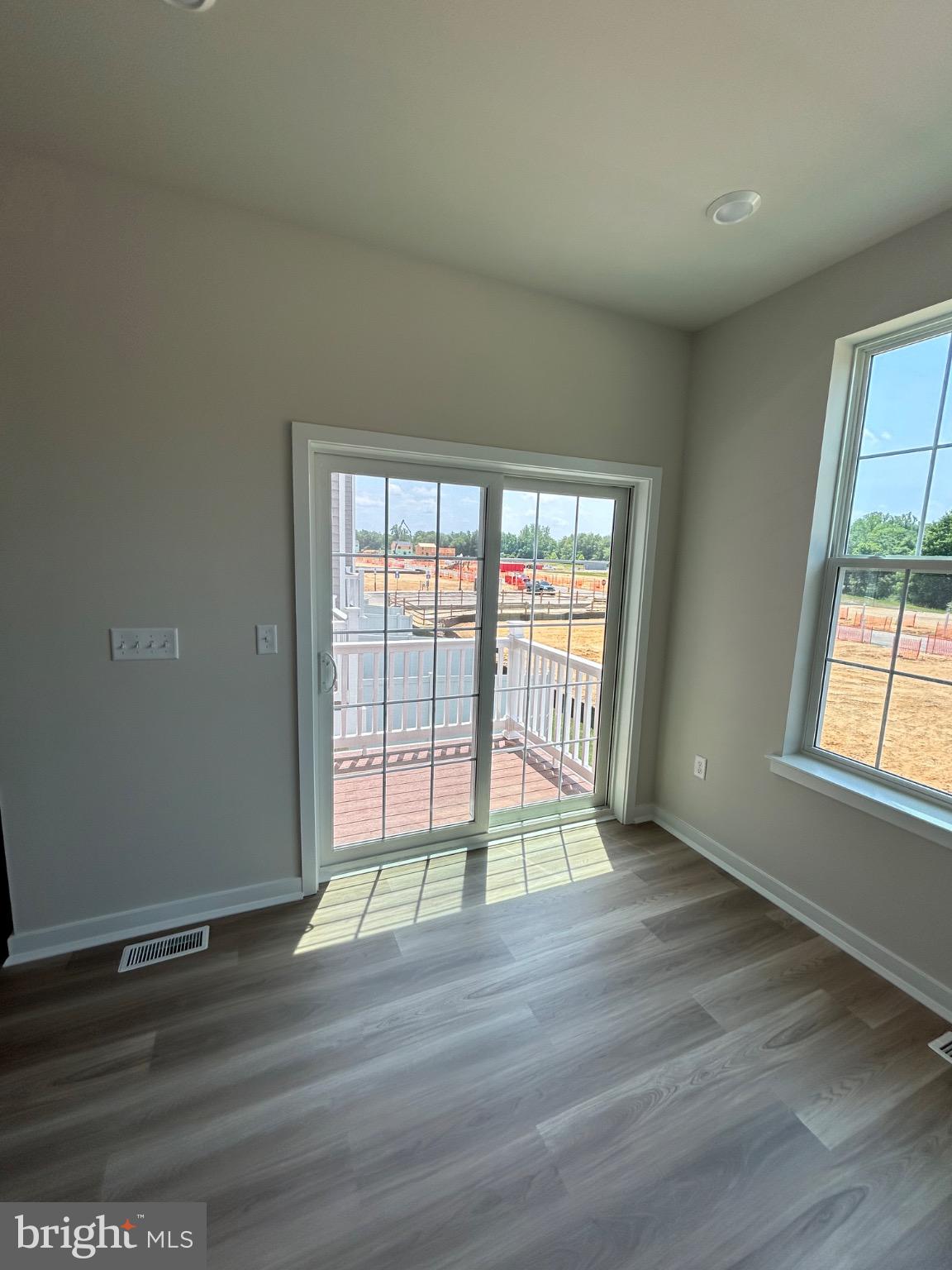 28 Barnes Way Sicklerville, NJ 08081 - Photo 38 of 40 an empty room with wooden floor and windows