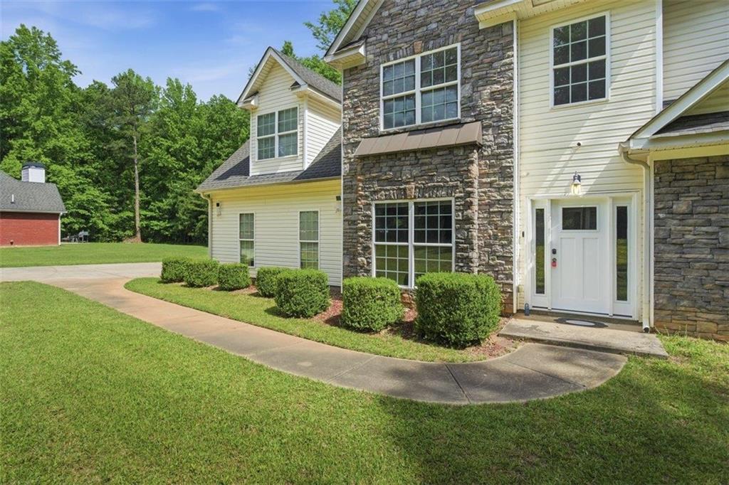 1231 Hillview Road Hampton, GA 30228 - Photo 3 of 49 a front view of a house with garden