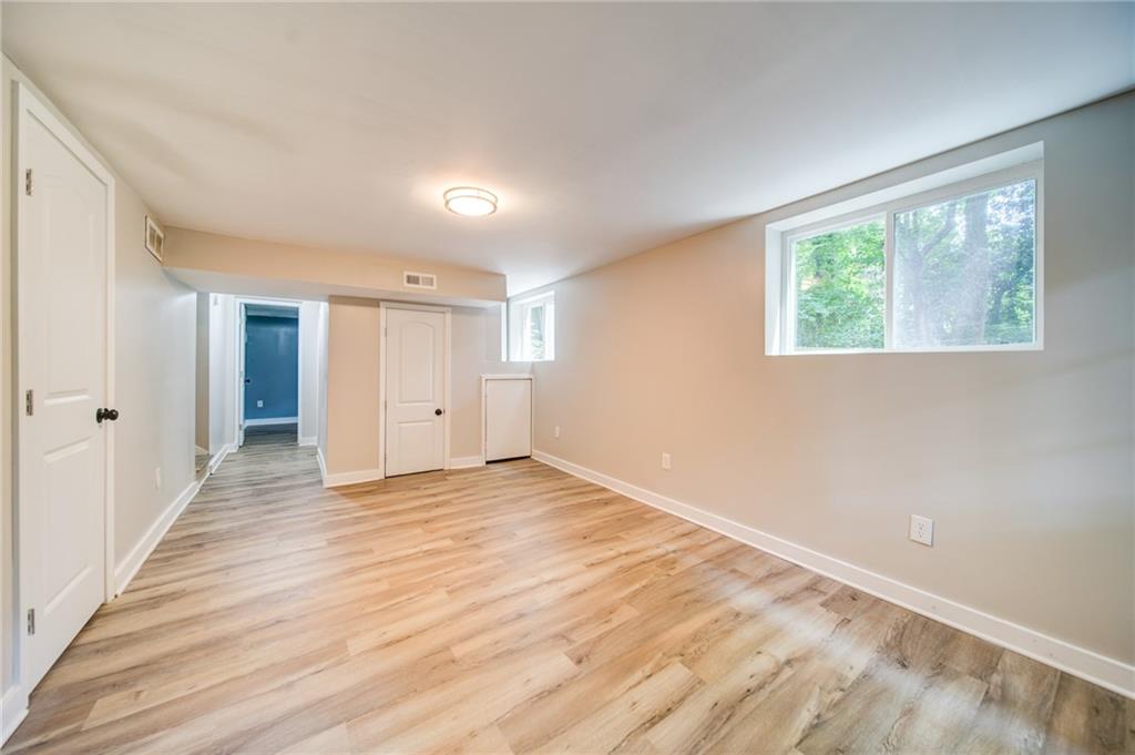 2951 Haralson Road Decatur, GA 30033 - Photo 23 of 25 a view of an empty room with wooden floor and a window