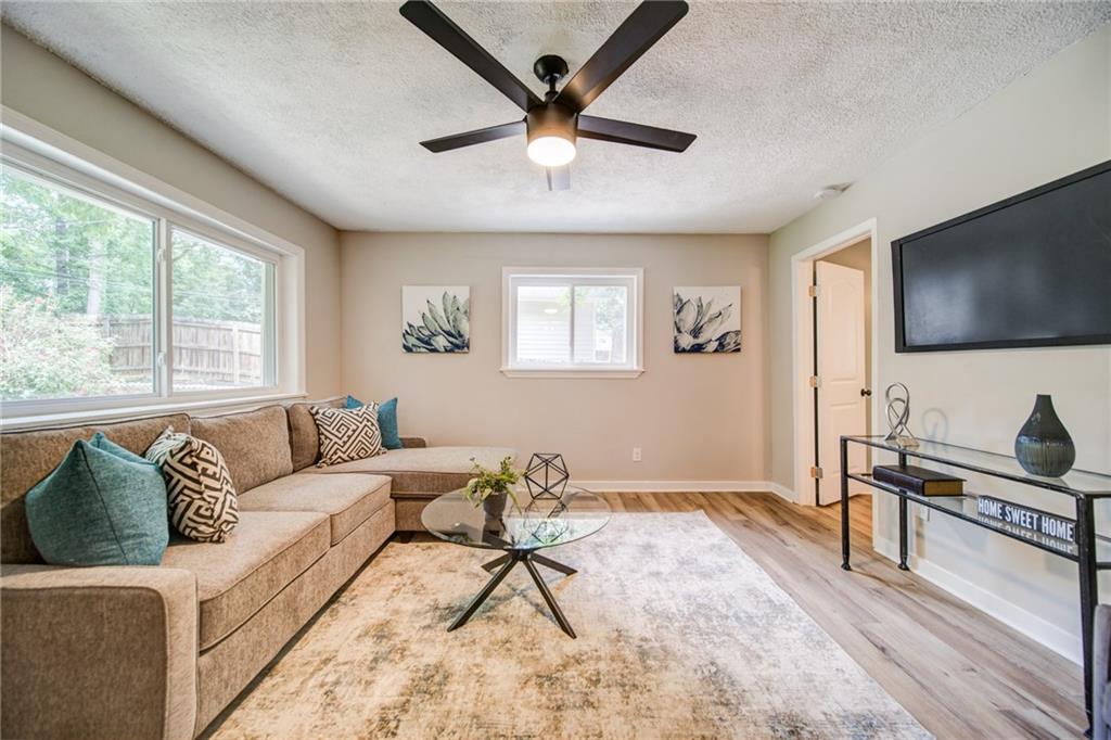 2951 Haralson Road Decatur, GA 30033 - Photo 10 of 25 a living room with furniture and a flat screen tv