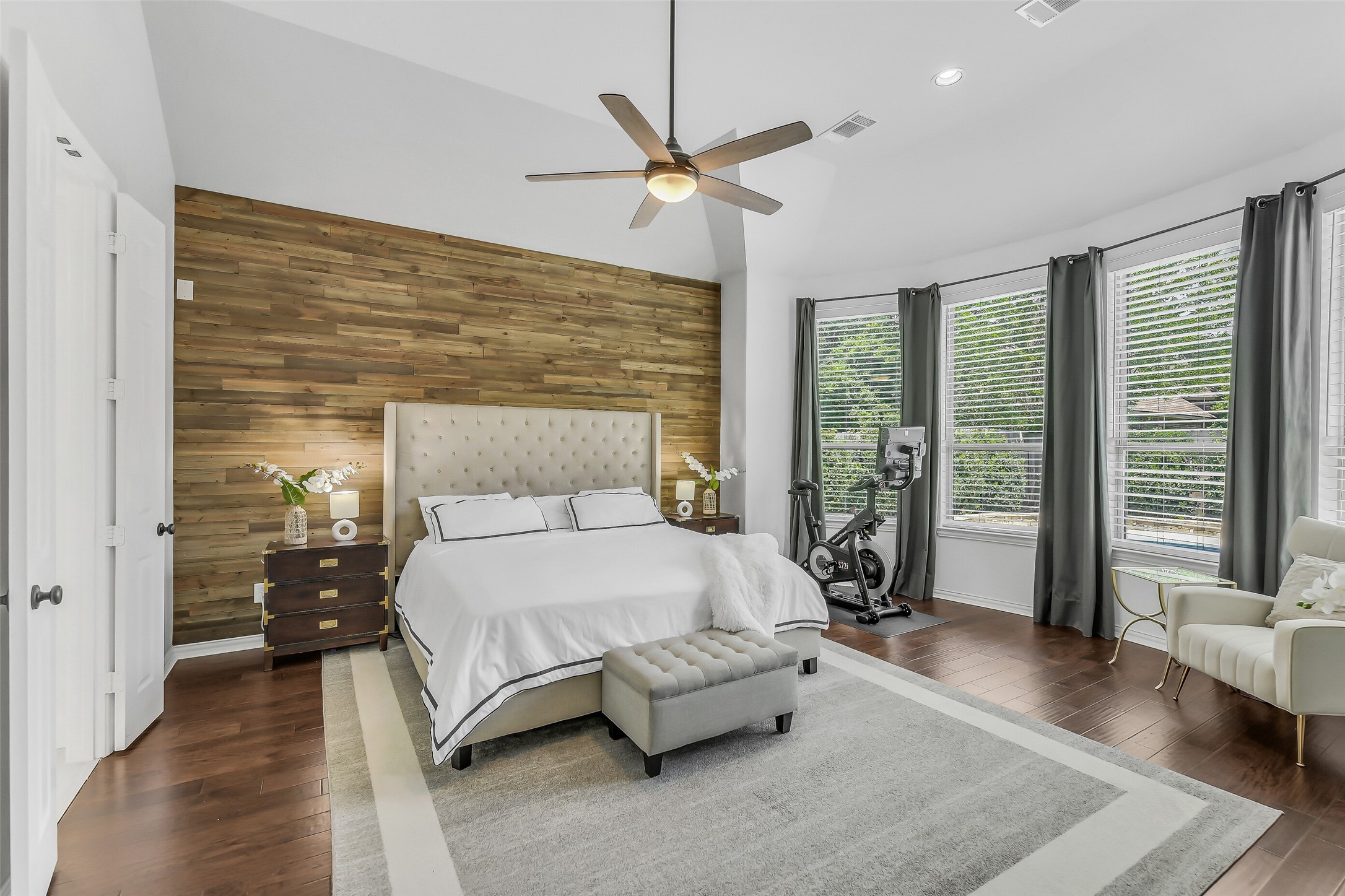 12207 Shorebridge Road Cypress, TX 77433 - Photo 18 of 41 a spacious bedroom with a bed and glass door