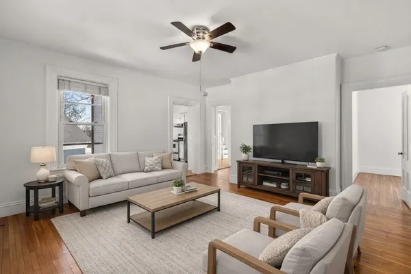 a living room with furniture and a flat screen tv