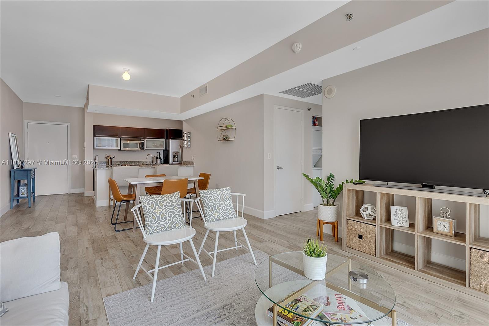 a living room with furniture and a flat screen tv