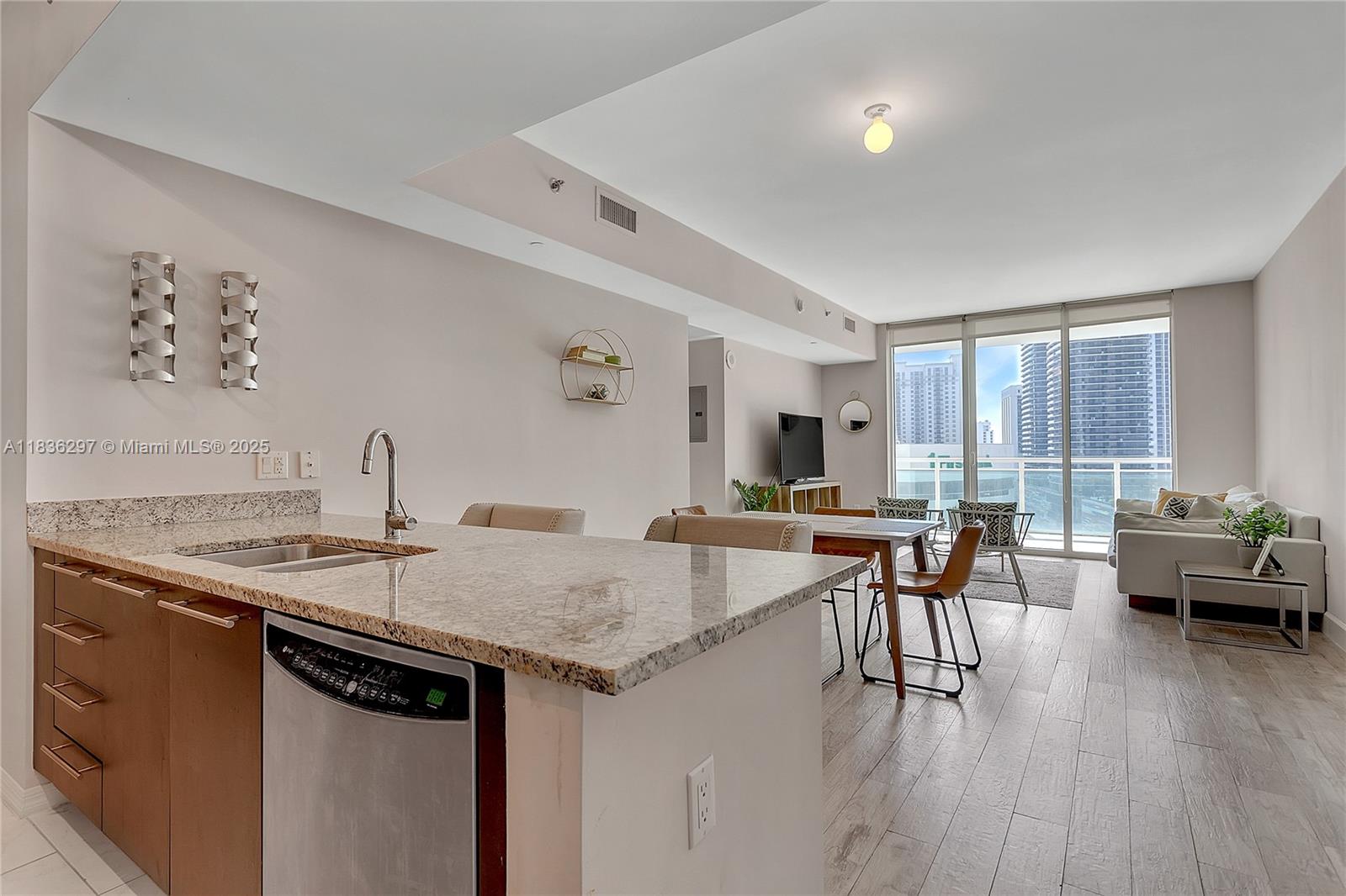 Brickell Miami, FL 33131 - Photo 3 of 17 a view of a dining room with furniture and wooden floor
