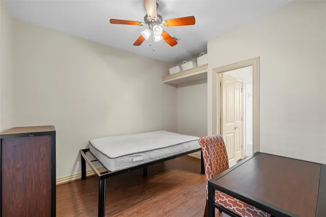 a view of a room with a table and chairs
