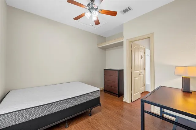 a bedroom with a bed and a table in it