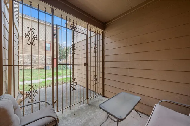 a view of a room with furniture and a window
