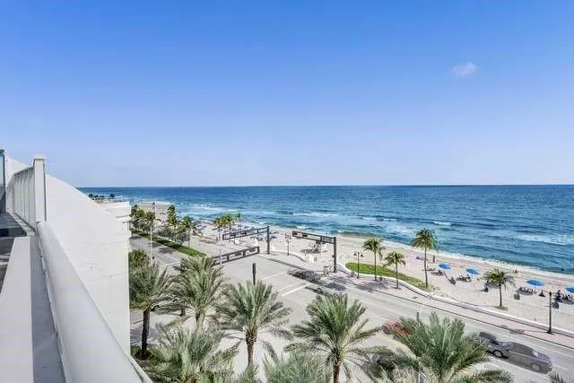 a view of water heater room with wooden floor