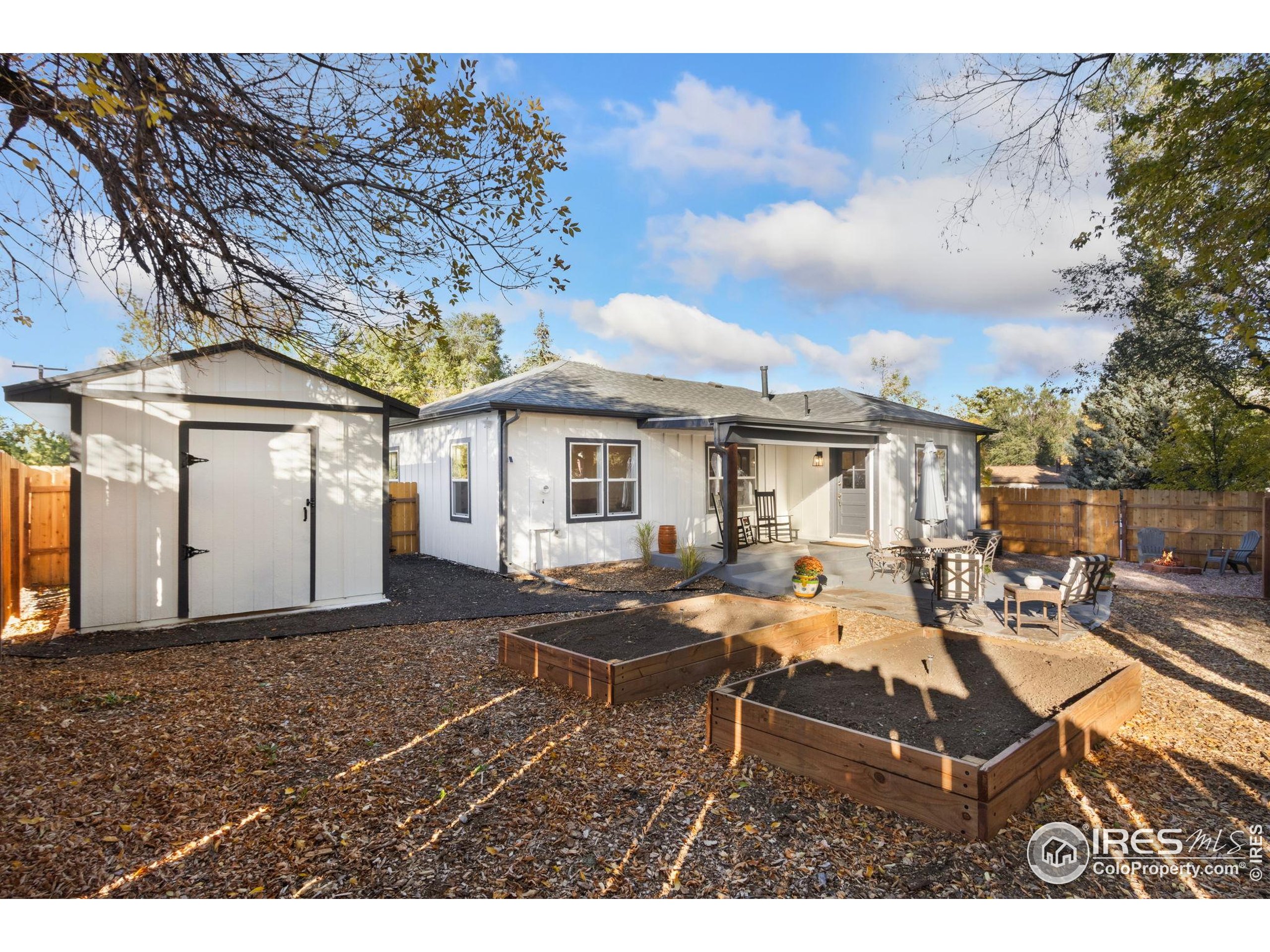 437 Clover Lane Fort Collins, CO 80521 - Photo 11 of 22 a view of a house with backyard and sitting area