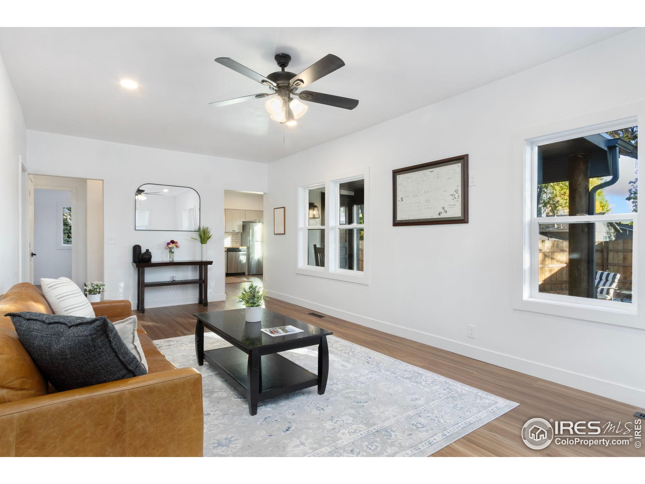 437 Clover Lane Fort Collins, CO 80521 - Photo 4 of 22 a living room with furniture and a window
