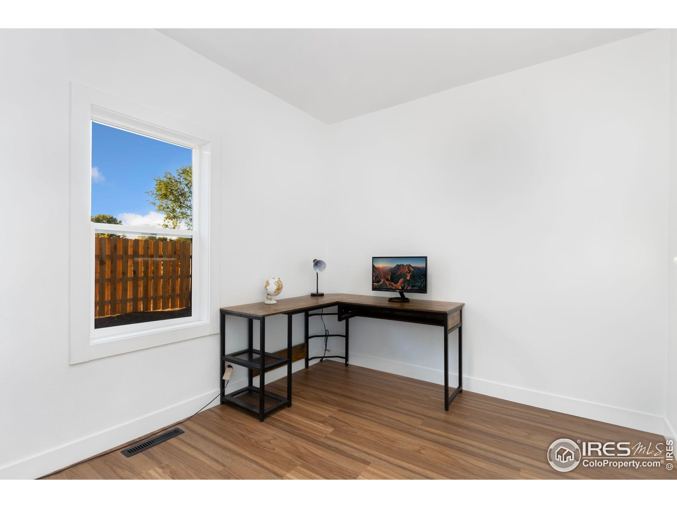 437 Clover Lane Fort Collins, CO 80521 - Photo 8 of 22 a view of a workspace with furniture and a window